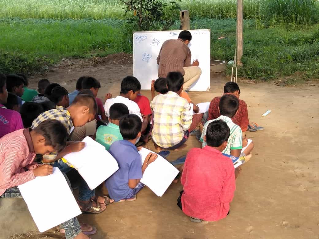 Volunteers and children participating in SHINE activities